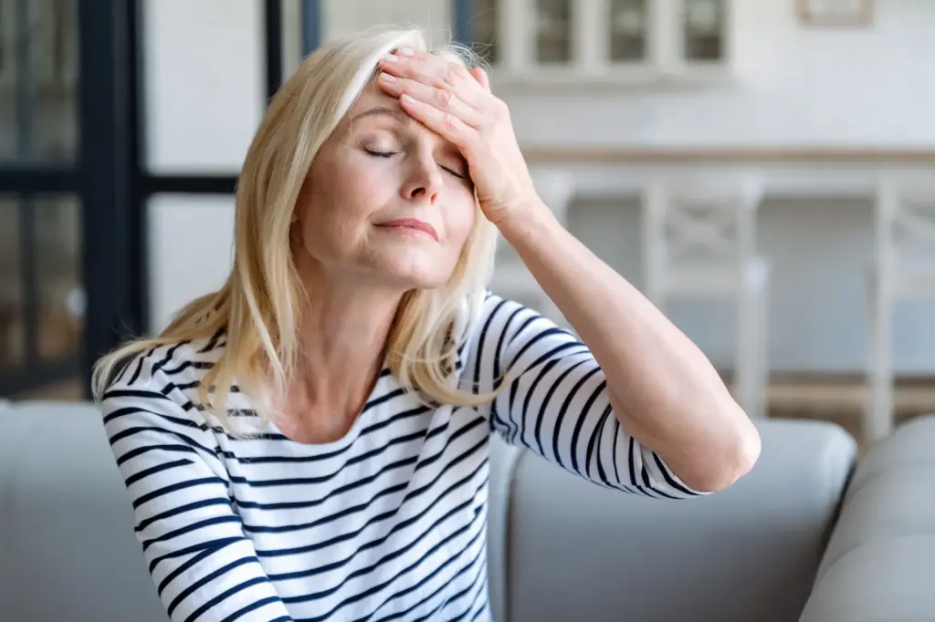 Why Travel Vaccines Matter: What to Know Before Your Trip 2 sick mature woman touching forehead suffering from headache 1