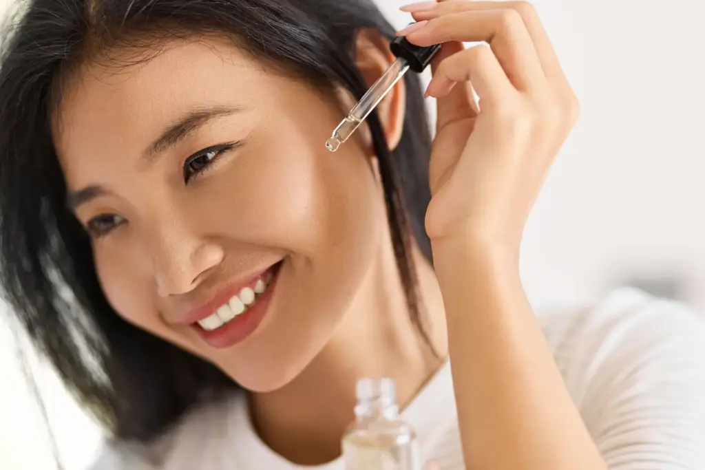 skin care beauty woman applying facial serum with 2025 03 07 15 03 19 utc 1